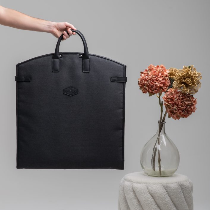Bespoke leather garment bag handcrafted for luxury travel and classic car touring
